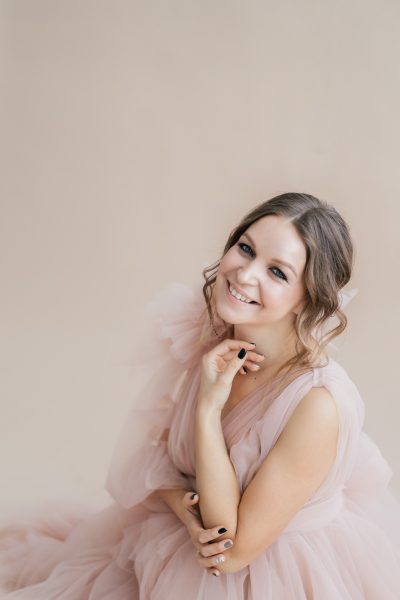 studio-portrait-young-pretty-pregnant-woman-creamy-fluffy-dress-beige-background.jpg