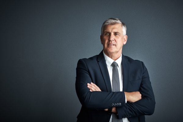 crossed-arms-mature-businessman-studio-thinking-decision-insight-investment-gray-background-corporate-manager-person-with-ideas-reflection-space-finance-career.jpg