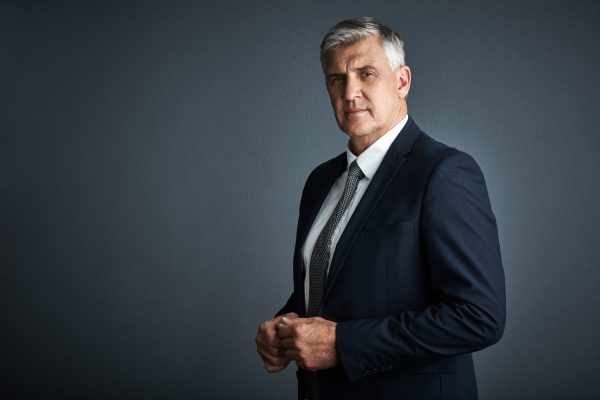 portrait-mature-businessman-lawyer-studio-with-advocacy-career-law-expertise-justice-confident-person-attorney-with-pride-legal-aid-ambition-mockup-space-dark-background.jpg