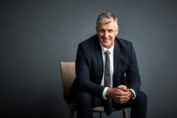 portrait-investor-happy-man-chair-professional-career-ambition-dark-studio-background-mature-person-space-financial-advisor-with-pride-confidence-about-us-trading-company.jpg