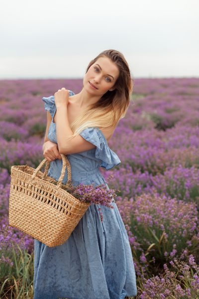 blonde-woman-rain-lavender-field-provence-gathering-flowers-into-wicker-bag-8.jpg