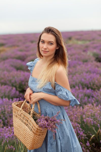 blonde-woman-rain-lavender-field-provence-gathering-flowers-into-wicker-bag-7.jpg