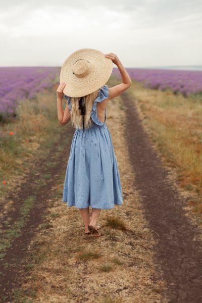 woman-dirty-ground-way-blue-dress-wicker-hat-lavender-fields-provence-3.jpg