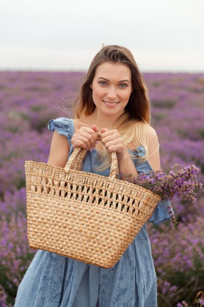 blonde-woman-rain-lavender-field-provence-gathering-flowers-into-wicker-bag-6.jpg