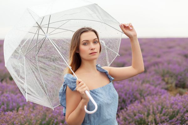 woman-transparent-umbrella-close-up-soft-focus-photo-rain-lavender-fields.jpg