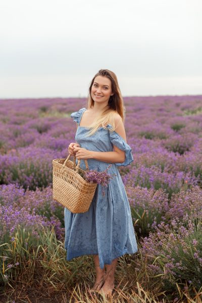 blonde-woman-rain-lavender-field-provence-gathering-flowers-into-wicker-bag-3.jpg
