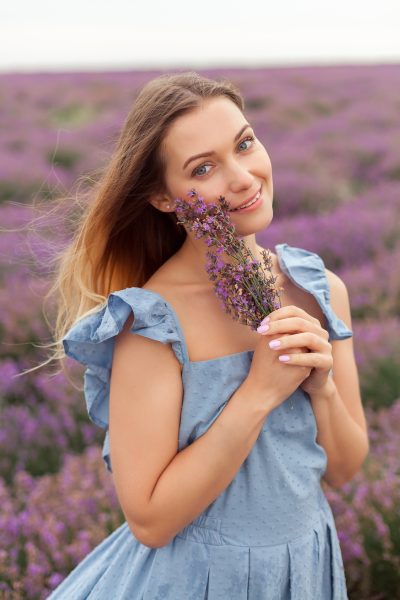 blonde-woman-rain-lavender-field-provence-gathering-flowers-into-wicker-bag-2.jpg