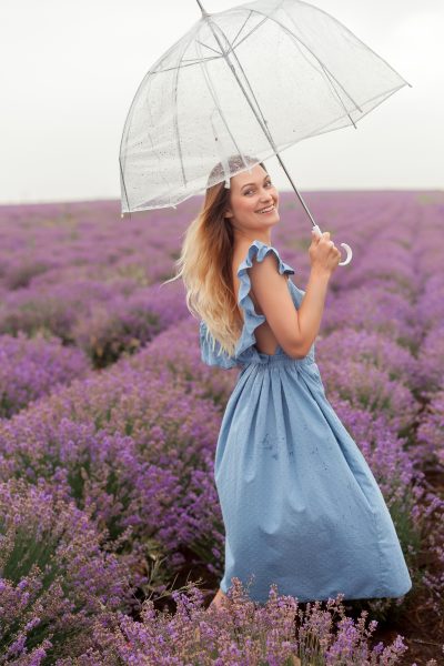 transparent-umbrella-woman-dancing-rain-lavender-field-blue-wet-dress.jpg