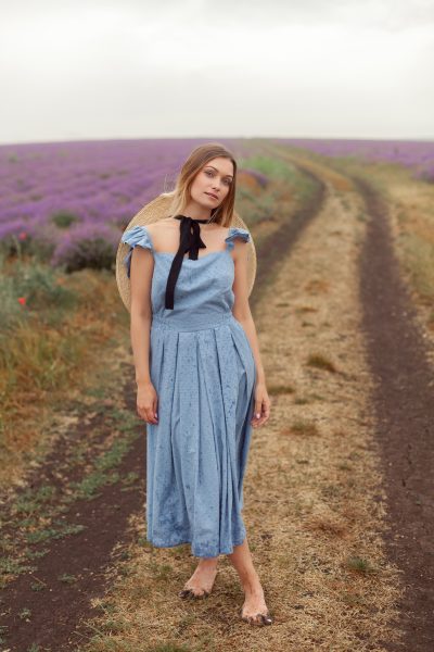 woman-dirty-ground-way-blue-dress-wicker-hat-lavender-fields-provence.jpg